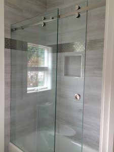 Barn style, frameless serenity, hydroslide shower doors.