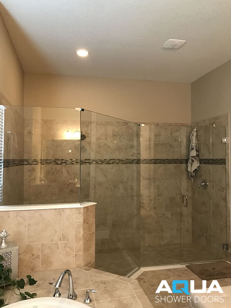 3/8” Frameless Clear Glass Shower Door with a Fixed Panel on a Rise, Notched Panel, In-line Panel, Mitered Edges, 6” C-Pull Handle, U-Channel and Chrome Hardware Finish.